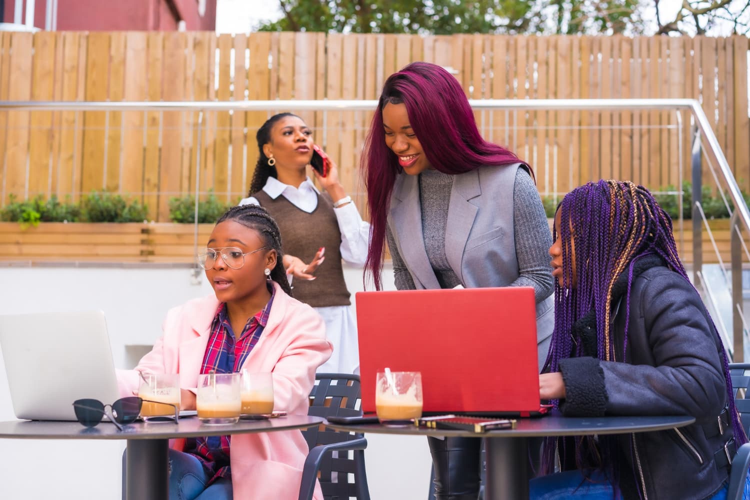 Nigerian sales team working together at a Lagos café